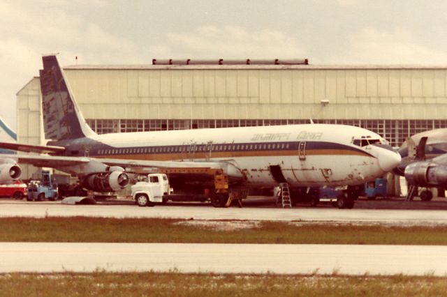 Boeing 707-300 (N725CA) - 707-321 at KMIA in Oct. 1982 - faded Bangladesh Biman titles visible on fuselage.