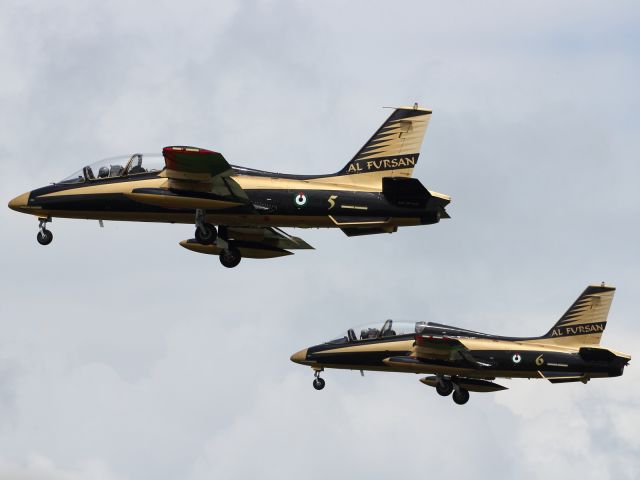 — — - Al Fursan, 7 Aermacchi UAE Air Force, Aerobatic Team, performing at RIAT 2012.