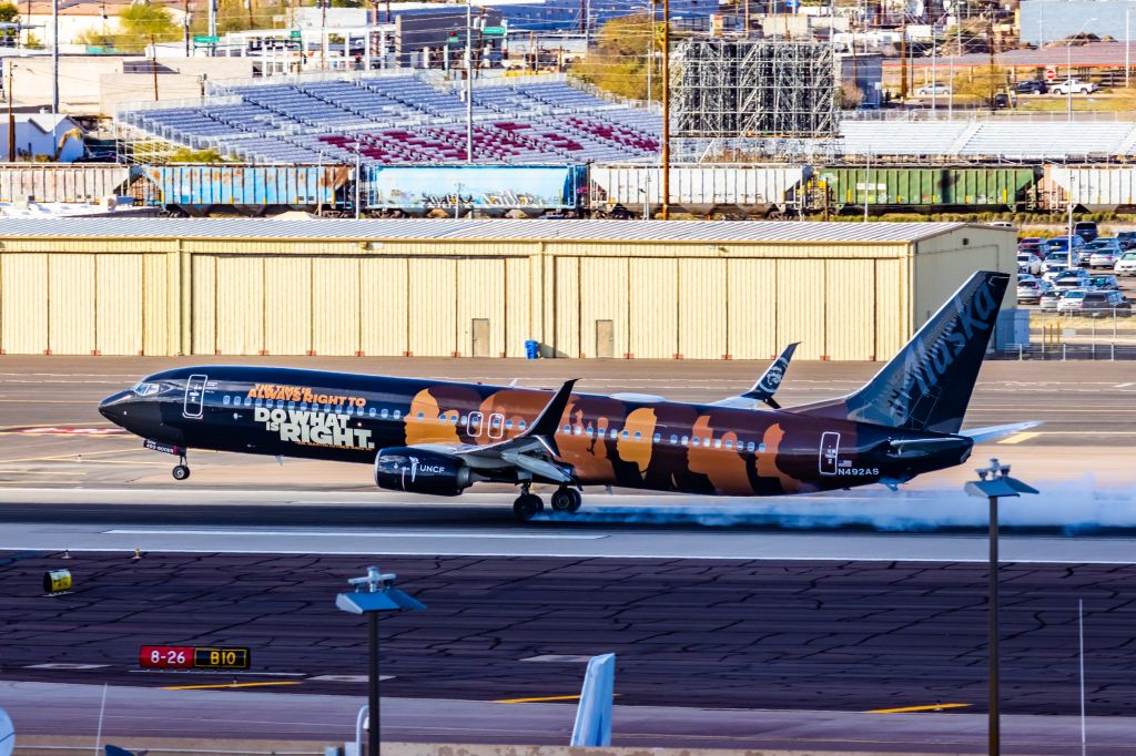 Boeing 737-900 (N492AS) - An Alaska Airlines 737-900 in UNCF special livery landing at PHX on 2/28/23. Taken with a Canon R7 and Canon EF 100-400 L ii lens.