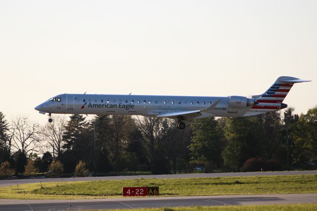 Canadair Regional Jet CRJ-900 (N599NN) - AA5598 arrives from KCLT on 4/22/21.  Fourth window behind aft wing exit my son is looking out the window.