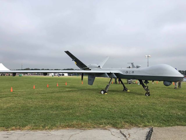 General Atomics Reaper (02-4003) - A General Atomics Aeronautical Systems Inc MQ-9 Reaper, the featured Aircraft for the 2018 United States Air Force Marathon, on display before the opening ceremonies at the National Museum of the United States Air Force/Wright-Patterson Air Force Base on 15 Sep 2018. MQ-9, 02-4003, c/n PB-003, was brought in from Creech Air Force Base, NV for the festivities. My wife and I participated in the 5K (14 Sep 2018) and 10K (15 Sep 2018) portions.