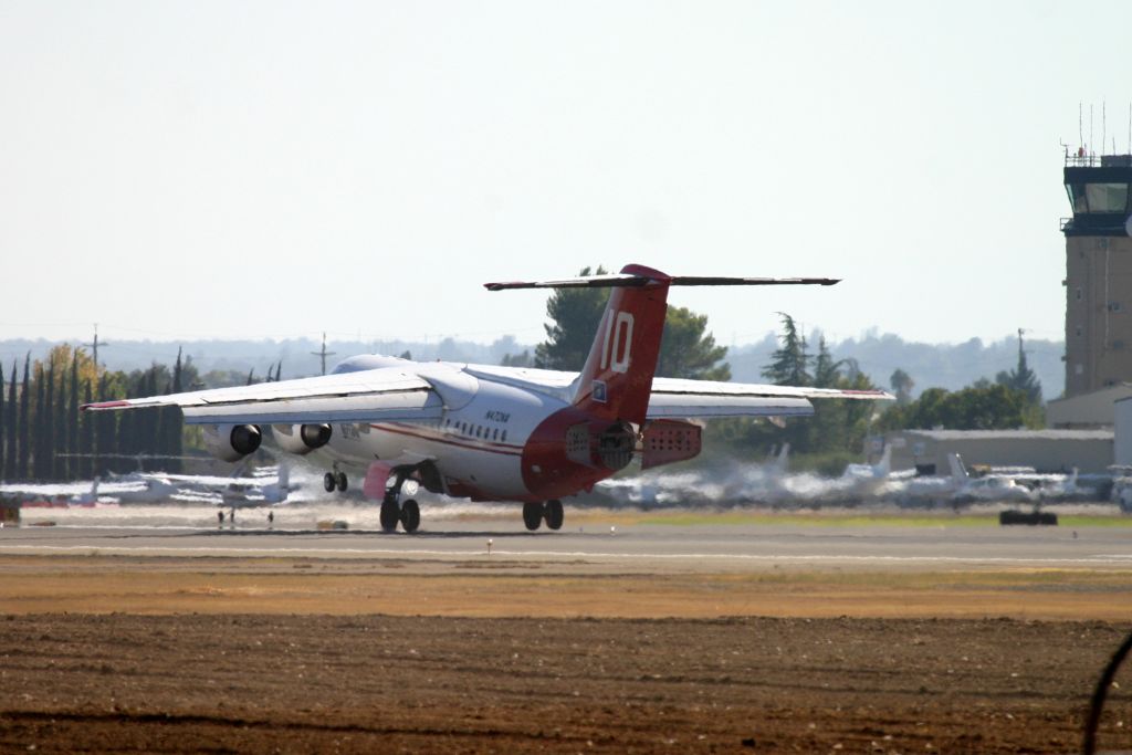 British Aerospace BAe-146-200 (N472NA) - KRDD - Tanker 10 (BAe-146-200) touching down with the Redding tower watching closely - funny the clam shell doors open when the head winds were 20-25 gusting - I can imagine this was to stop and turn right quickly to get back and reload to then relaunch for the Boles Fire 2014.br /br /E2138br /Aircraft Type British Aerospace 146-200Abr /First Flight 29. Jun 1989br /Age 27.0 Yearsbr /Test registration G-5-138