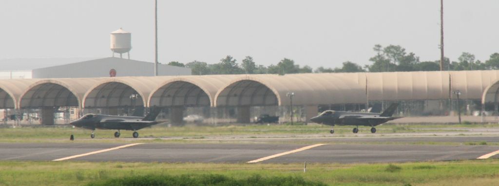 Lockheed F-35C — - F-35s taxi. I was driving north out of Destin passing Eglin AFB where they had numerous jets performing touch & gos. I pulled over and took photos of this impromptu airshow.