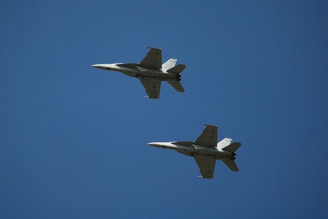 — — - Two F-18F Super Hornets landing at Whiteman AFB for a fuel stop.