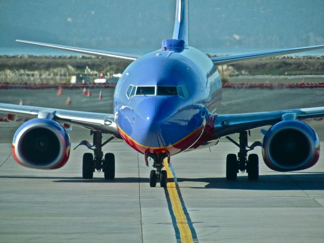 Boeing 737-700 — - A SWA 737 taxiing to the gate at Oakland.