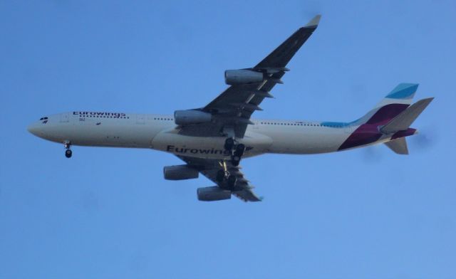 Airbus A340-300 (OO-SCX) - Eurowings (Brussels Airlines), A340-313X, OO-SCX, EWG1132 on short finals for runway 09 Barbados, Grantley Adams. First time I've seen a Eurowings A340 at BGI.