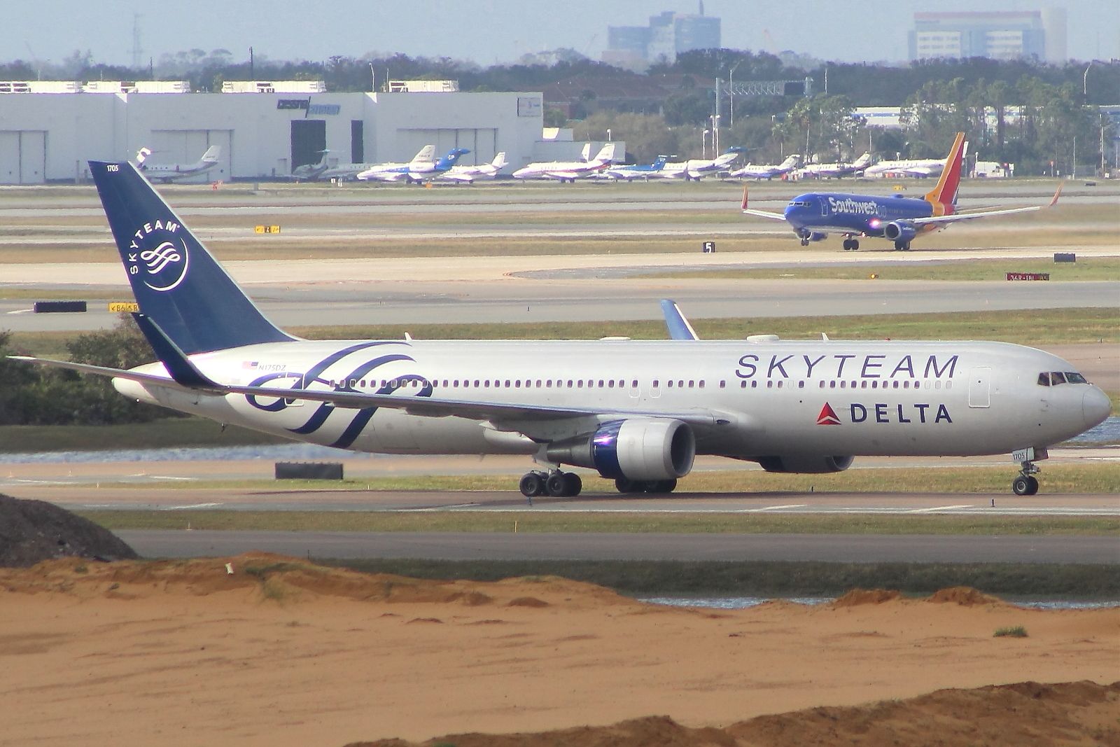 BOEING 767-300 (N175DZ) - Shortly after landing, as Southwest takes off