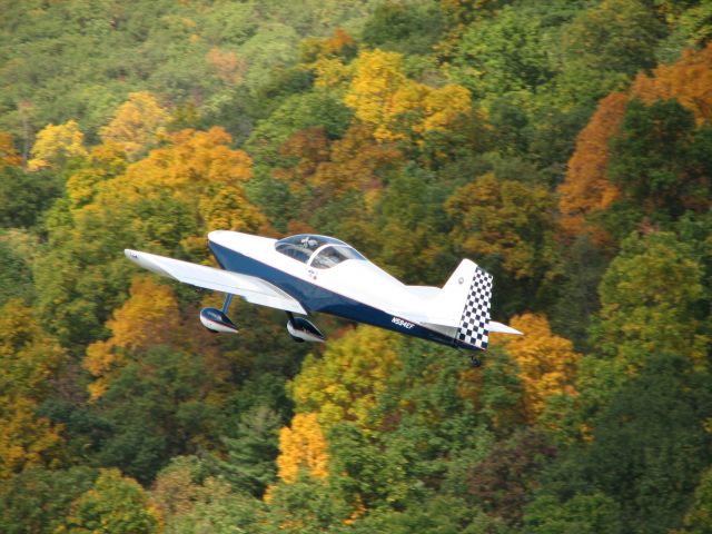 Experimental 100kts-200kts (N594EF) - One of my favorite pictures. He really looks great against the early fall colors.