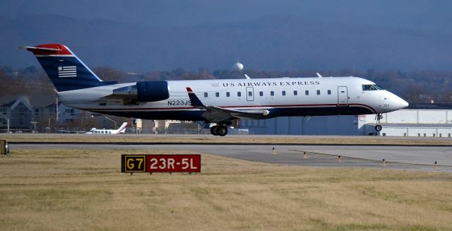 Canadair Regional Jet CRJ-200 (N223JS) - Canadair Region Jet 200 USAir Express landing on runway 23L at McGhee Tyson in Alcoa, TN