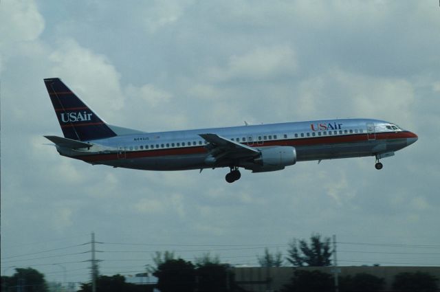 BOEING 737-400 (N441US) - Short Final at Miami Intl Airport on 1990/08/28