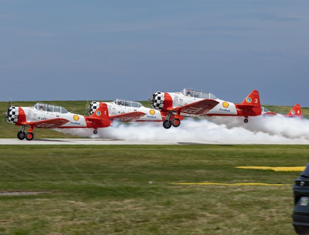 North American T-6 Texan (N3267G) - The Aeroshell Aerobatic Team in their North American AT-6G Texans’ demonstrating Piston power at the Cleveland National Airshow over the Labor Day weekend (3 Sep 2023).