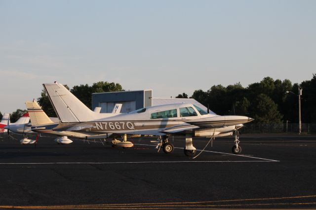 Cessna 310 (N7667Q) - Parked at the ramp