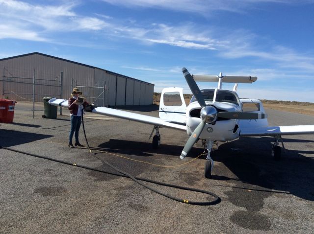 Piper Saratoga (VH-MNV) - Fills us up Kim Dobbos waiting next stop Wilpena Pound and Ayers Rock