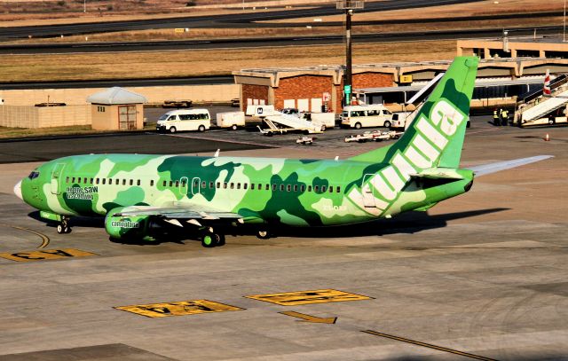 BOEING 737-400 (ZS-OAF) - Love the "Camoplane" and the motto - "No one saw us coming" - maybe an airline with a sense of humour?