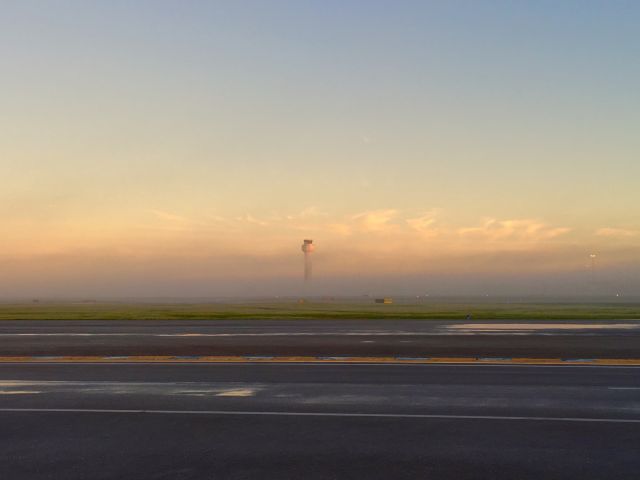 — — - PBI tower in the fog