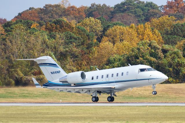 N86NP — - N86MP is a 2011 Bombardier Challenger 600 seen here departing Atlanta's PDK executive airport. I shot this with a Canon 100-400mm IS II lens at the focal length of 271mm. Camera settings were 1/5300 shutter, F5, ISO 640.  Please check out my other photography. Votes and positive comments are always appreciated. Questions about this photo can be sent to Info@FlewShots.com