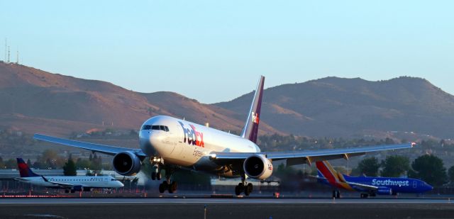 BOEING 767-300 (N149FE) - As the sun is coming up over the Virginia Range Mountains east of the airport, Fed Ex's "Lailana," a B763 (N149FE), is coming down on to Runway 16L to complete the first half of the daily morning KMEM-KRNO-KMEM round trip route.