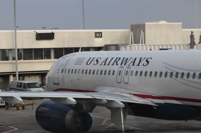 Airbus A320 (N658AW) - Rear view of N658AW approaching gate at CLT on 4/27/12