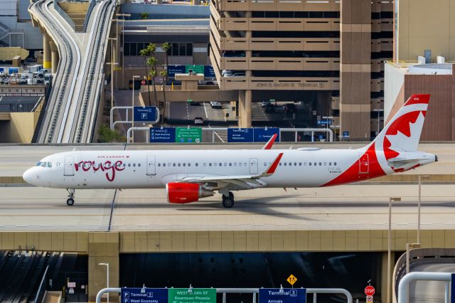 Airbus A321 (C-FJQL) - An Air Canada Rouge A321 taxiing at PHX on 2/11/23 during the Super Bowl rush. Taken with a Canon R7 and Canon EF 100-400 II L lens.