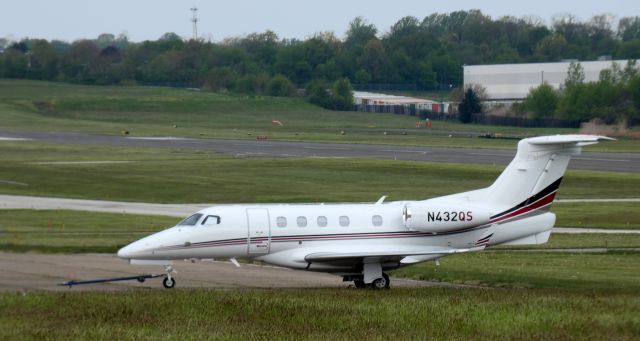 Embraer Phenom 300 (N432QS) - Catching some tarmac time is this 2019 Embraer Phenom EMB-505 in the Spring of 2020.