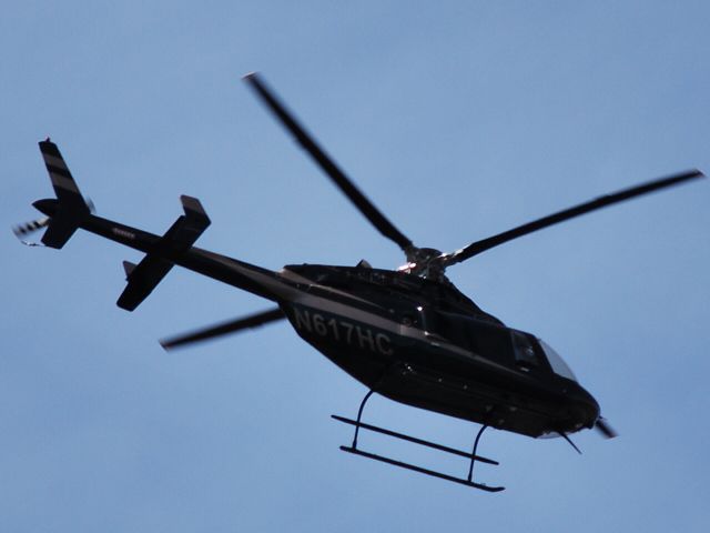 Bell 407 (N617HC) - LAND AIR GROUP INC - Buzzing the tree tops over Huntersville, NC - 2/20/09