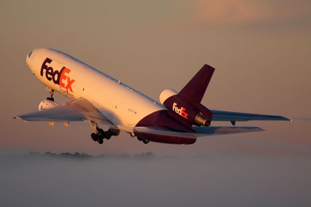 McDonnell Douglas DC-10 (N373FE) - Bursting through a thin fog bank