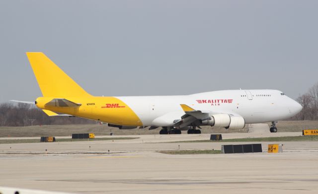 Boeing 747-400 (N743CK) - Kalitta/DHL taxing to RWY 18L.  New paint job looks good.