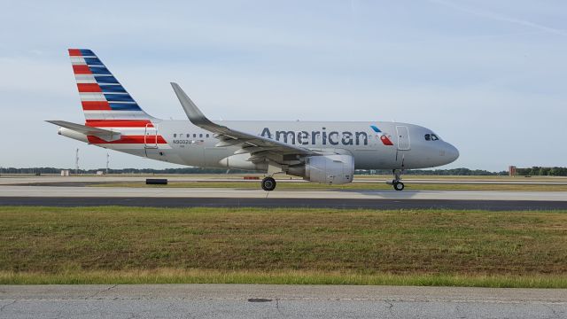 Airbus A319 (N9002U) - As seen from the cell phone waiting lot at KATL