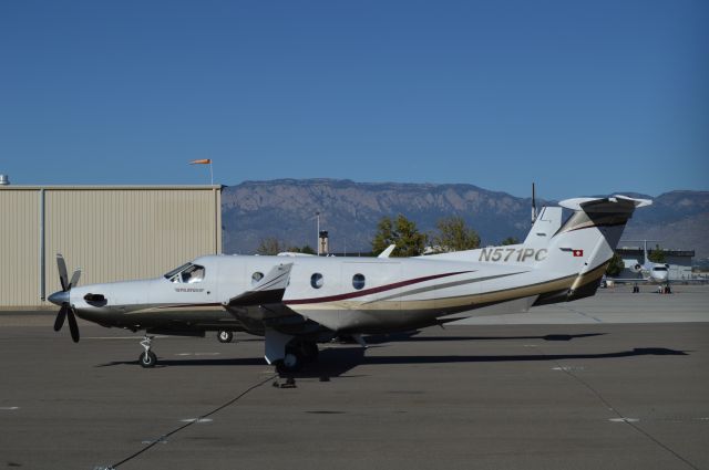 Pilatus PC-12 (N571PC) - Sandia Mountains in the background