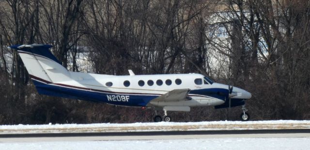 Beechcraft Super King Air 200 (N208F) - Taxiing for departure is this 1981 Beechcraft Super King Air 200 in the Winter of 2021.