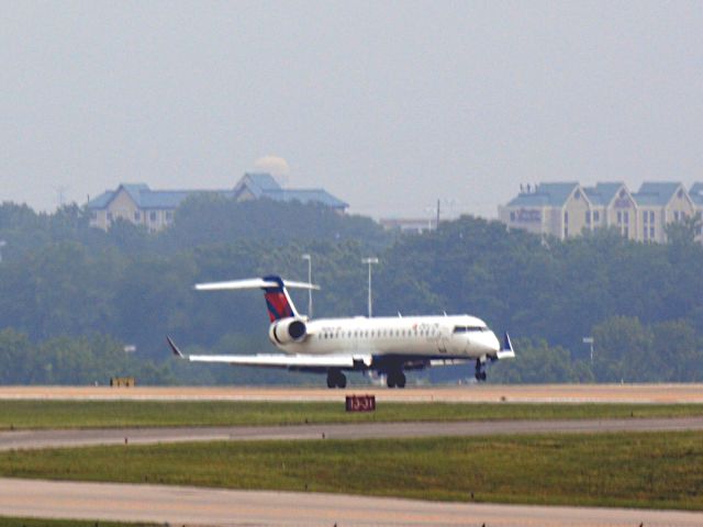 Canadair Regional Jet CRJ-700 (N656CA) - Mains touchdown on 20R on 5/19/2013