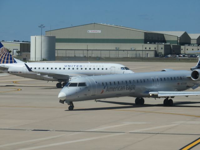 Canadair Regional Jet CRJ-900 (N556NN) - From the terminal at XNA.Heading out CLT.