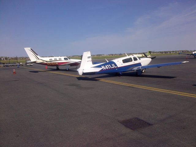 Piper Malibu Mirage (N518AM) - Unexpectedly meeting up with Big Daves Piper on the flight line at Logan.