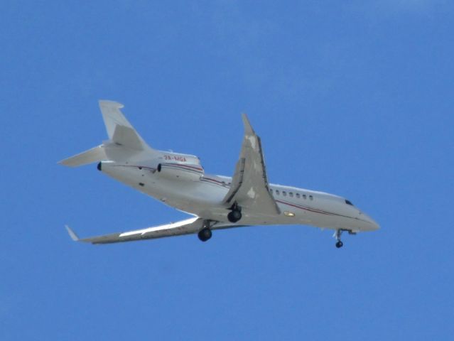 Dassault Falcon 900 (3A-MGA) - 3A-MGA on approach into Keflavik airport on 01 June 2015 at 15:23, flying just south of the IKEA, spotted from the bus 21 bus stop next to the IKEA near Reykjavik.