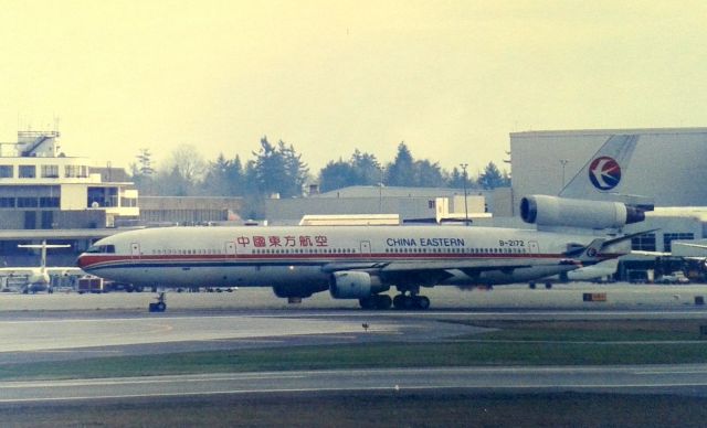 Boeing MD-11 (B-2172) - KSEA - China Eastern pax MD-11 rolling to the 16LR departure runways in Feb 1995. Photo from the SEA airpark( now closed )