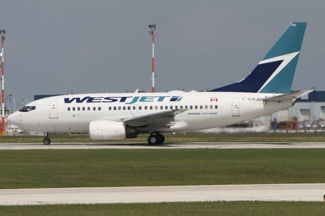 BOEING 737-600 (C-GWJU) - July 26, 2009 - leaving Winnipeg