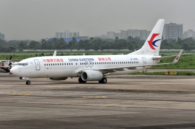 Boeing 737-800 (B-1255) - 28th August, 2024: Flight MU 2035 from Kunming Changshui taxiing to the gate via Charlie at Dhaka's Zia International Airport. 