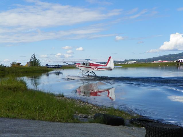 Piper L-21 Super Cub (N82714) - Taxiing in. No wind and glassy water.