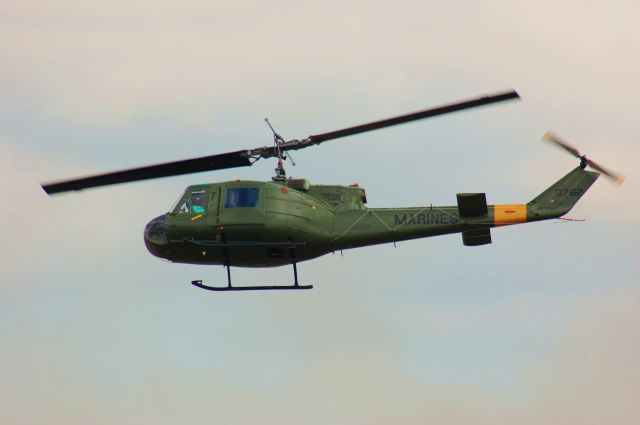 Bell UH-1V Iroquois — - A UH-1 Huey comes in to "rescue a downed pilot" at Wings Over Houston 2010.