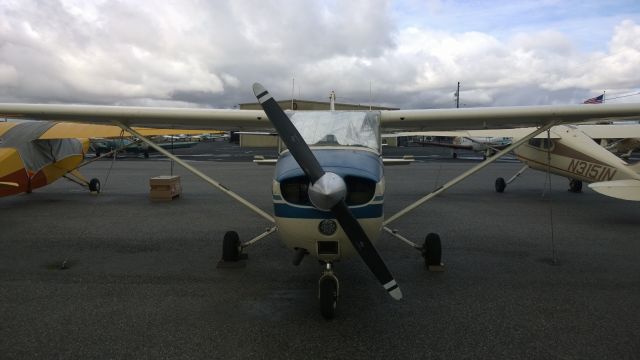 Cessna Skyhawk (N61672) - 1975 C172M sitting on the Aerodynamic Aviation ramp before a rainstorm comes in (taken on 04/25/2015).