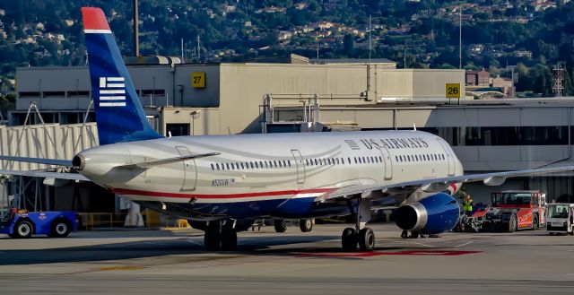 Airbus A321 (N970UY) - Sitting at the gate this American Airlines A321 waits for its next flight. Aircraft re-registered to N970UY from N520UW 