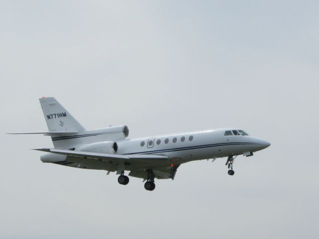 Dassault Falcon 50 (N771HM) - Out of the skies comes this Falcon to make another perfect landing. Shown here in the Spring of 2012.