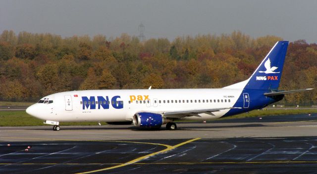 BOEING 737-400 (TC-MNH) - Turkish Cargo Carrier MNG Airlines is taxiing  gate