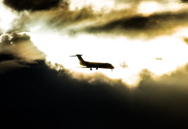 Boeing 717-200 (N477HA) - More creative edit this time - Hawaiian 717 "merging" with the sun on approach to 26L. Taken from Waikīkī Beach