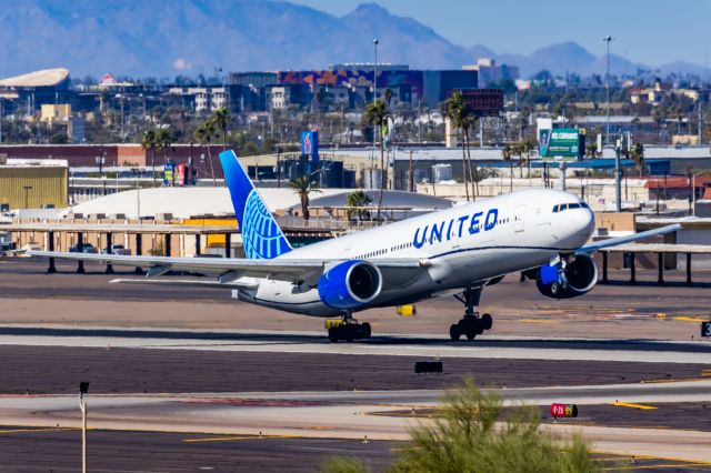 Boeing 777-200 (N777UA) - A United Airlines 777-200 taking off from PHX on 2/10/23 during the Super Bowl rush. Taken with a Canon R7 and Tamron 70-200 G2 lens.