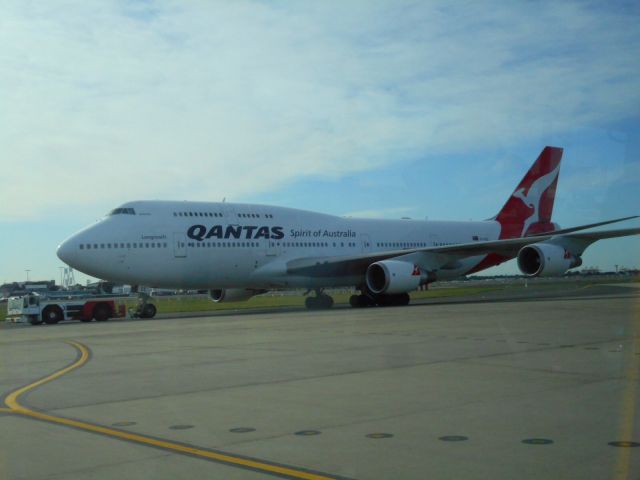 Boeing 747-400 (VH-OEE) - Taken from inside the airport transfer bus in Sydney from domestic to international