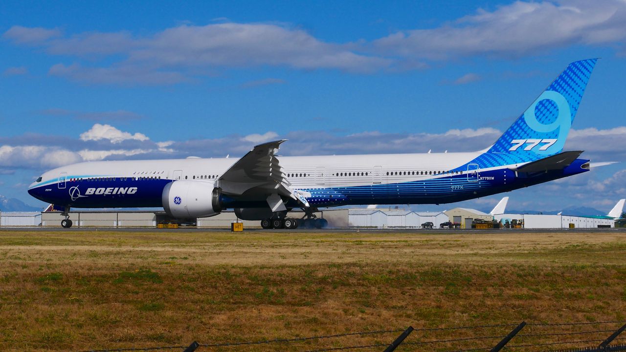 BOEING 777-9 (N779XW) - BOE001 braking after landing on Rwy 34L on 8.29.20. (B777-9 / ln 1567 / cn 64240). 