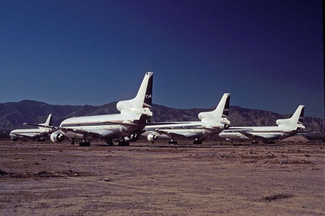 Lockheed L-1011 TriStar (N712DA) - From front to rear, Lockheed L-1011s N712DA, N724DA, N725DA, and N787DL formerly of Delta Airlines at Mojave on September 10, 2001. Their Lockheed construction numbers are 193C-1088, 193C-1151, 193C-1162, and 193C-1126, respectively. The most distant L-1011 was delivered to Eastern Airlines as N333EA in 1976. Delta purchased it in 1991. The three L-1011s in the front row were delivered to Delta Airlines in 1974, 1978, and 1979.