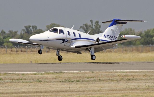 Eclipse 500 (N778TC) - Eclipse 500 landing runway one-two, Merced Regional Airport (KMCE)