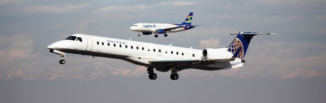 Embraer ERJ-145 (N11106) - Landing on 16L. Spirit Airbus behind it is landing on 16R.